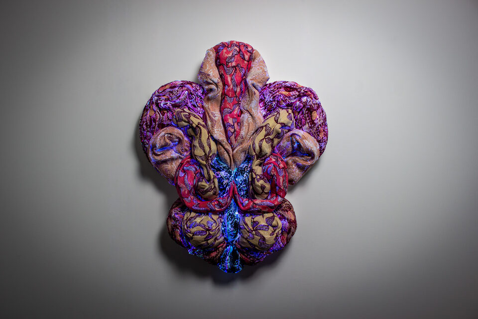 The artwork Andetag no. 12, textile sculpture in soft ambient light.