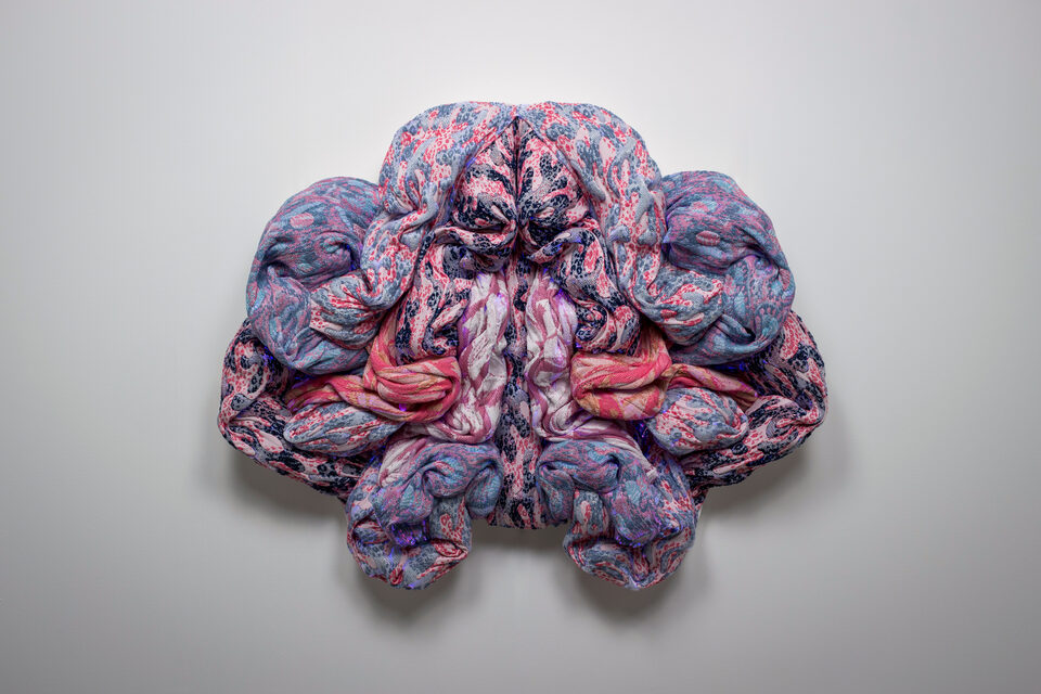 The artwork Andetag no. 13, textile sculpture in spotlight.