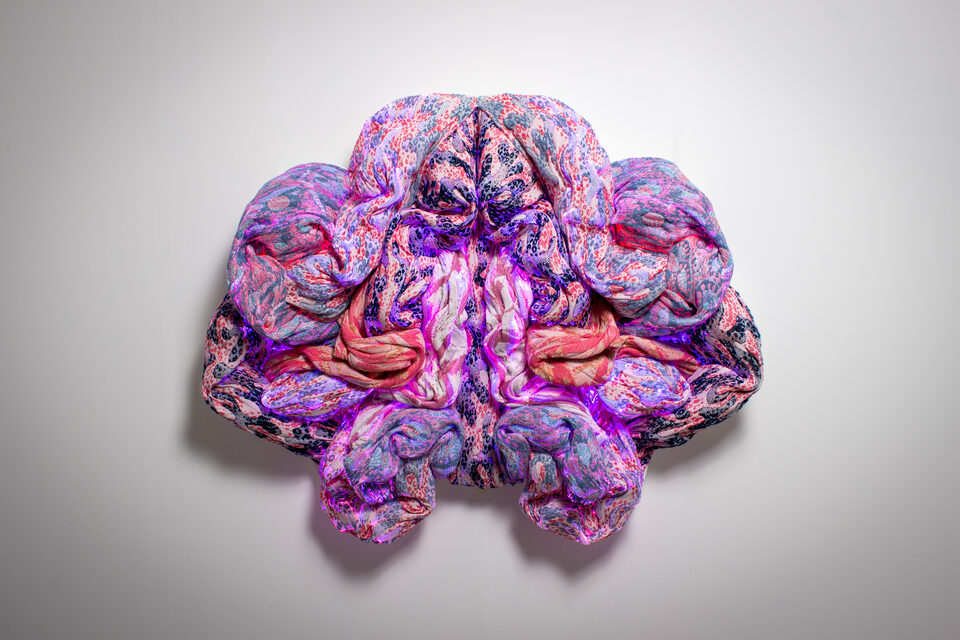 The artwork Andetag no. 13, textile sculpture in soft ambient light.