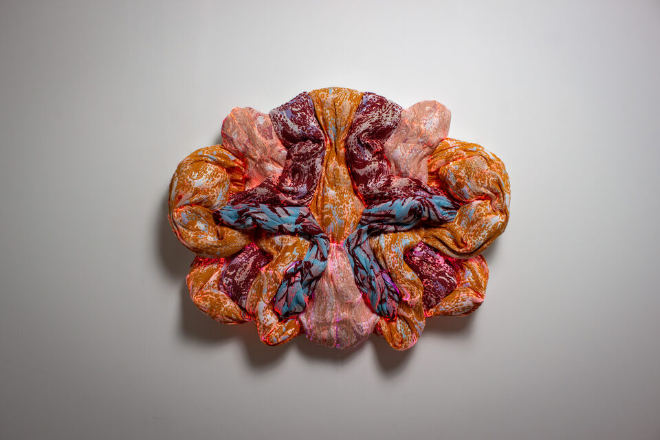 The artwork Andetag no. 14, textile sculpture in soft ambient light.