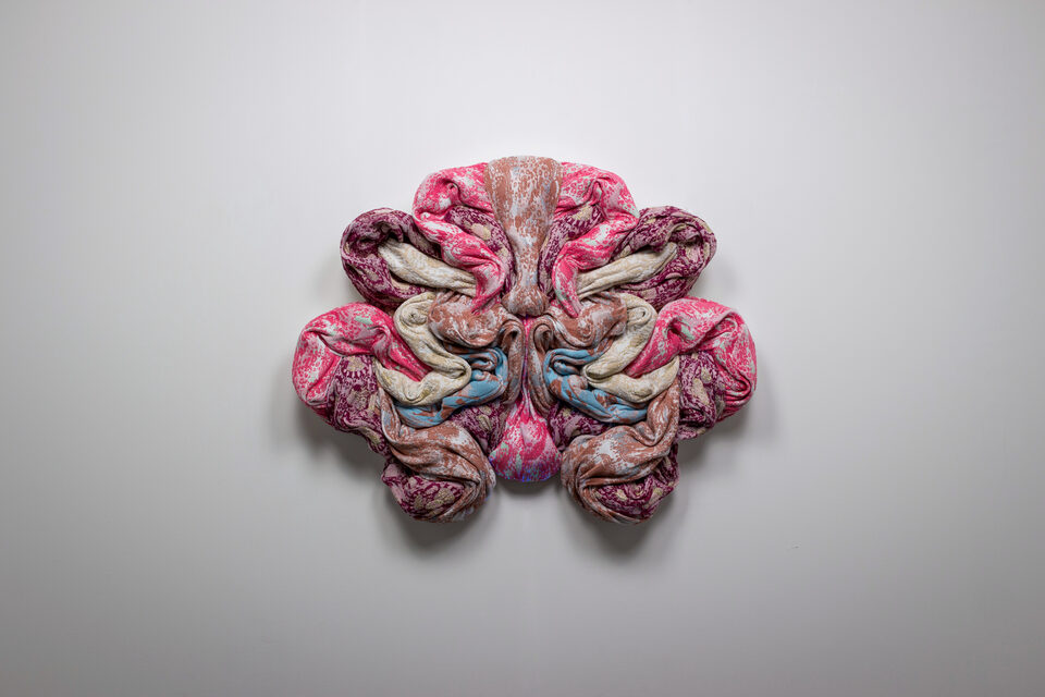 The artwork Andetag no. 16, textile sculpture in spotlight.