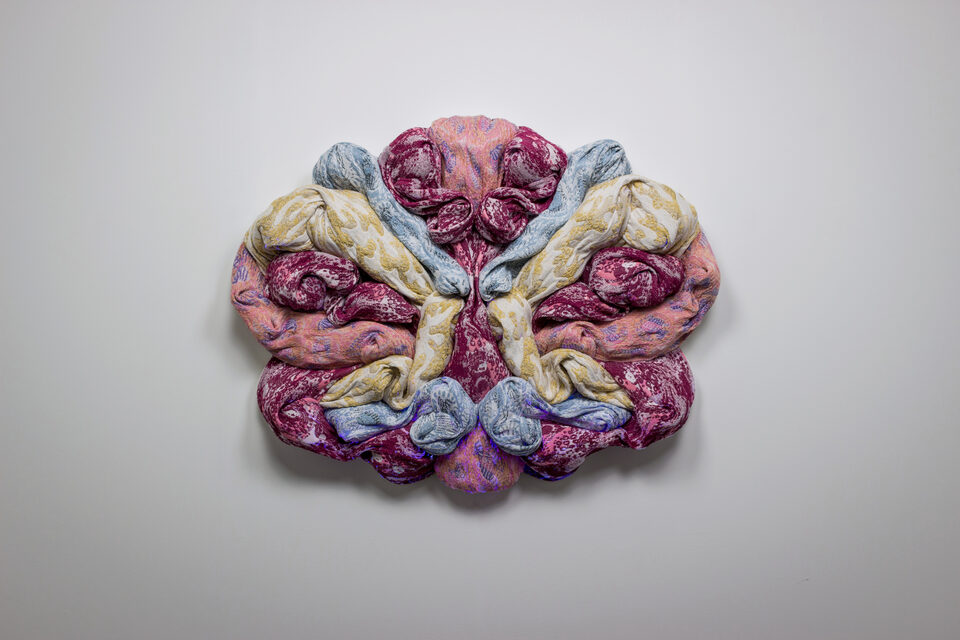 The artwork Andetag no. 18, textile sculpture in spotlight.