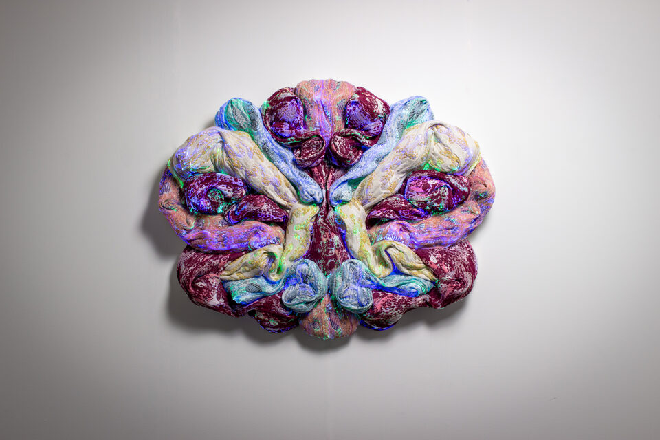The artwork Andetag no. 18, textile sculpture in soft ambient light.