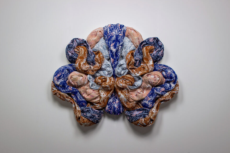 The artwork Andetag no. 19, textile sculpture in spotlight.