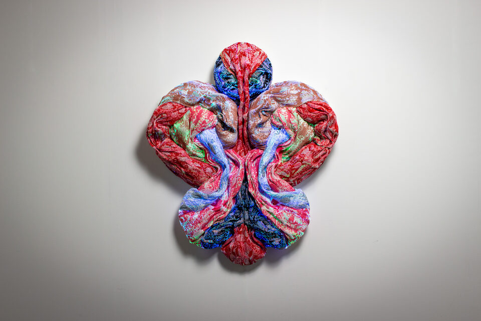 The artwork Andetag no. 24, textile sculpture in soft ambient light.