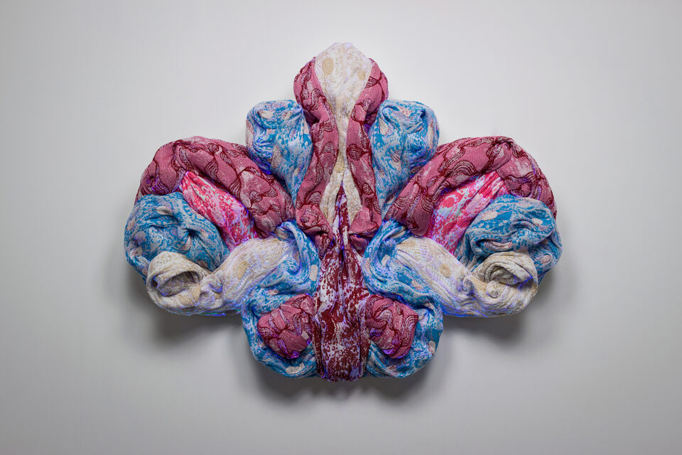 The artwork Andetag no. 26, textile sculpture in spotlight.