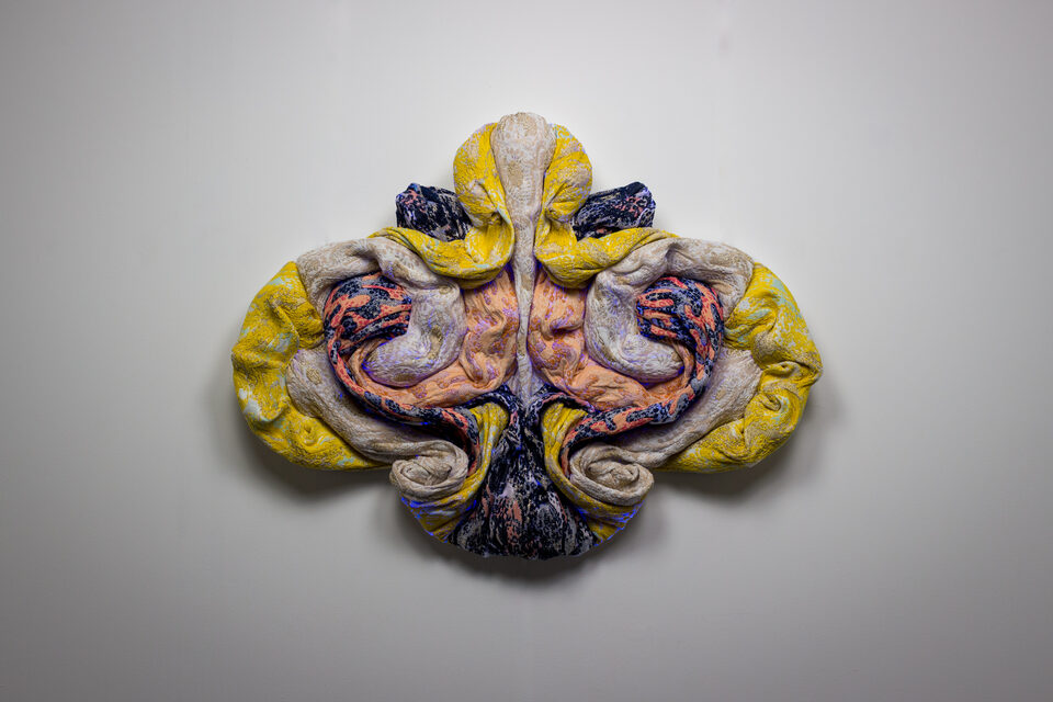 The artwork Andetag no. 27, textile sculpture in spotlight.