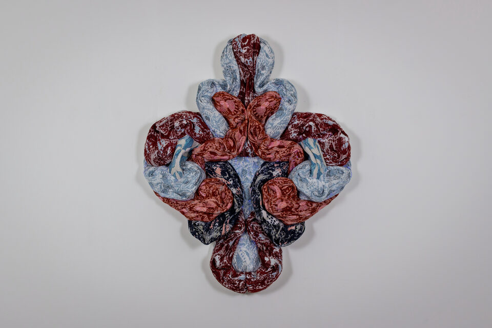 The artwork Andetag no. 37, textile sculpture in spotlight.