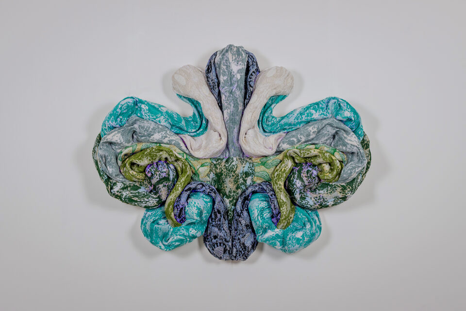 The artwork Andetag no. 38, textile sculpture in spotlight.