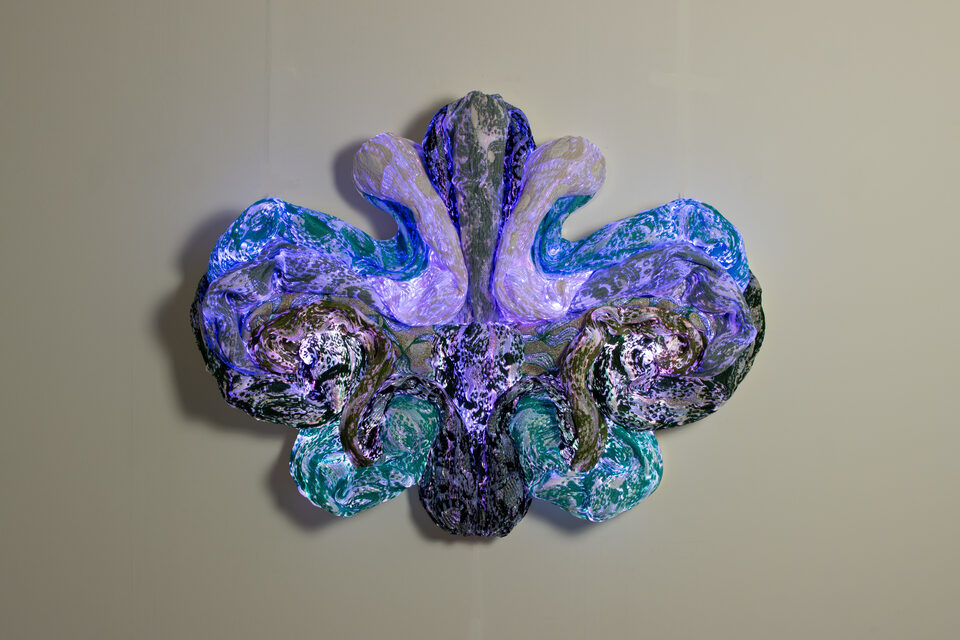 The artwork Andetag no. 38, textile sculpture in soft ambient light.