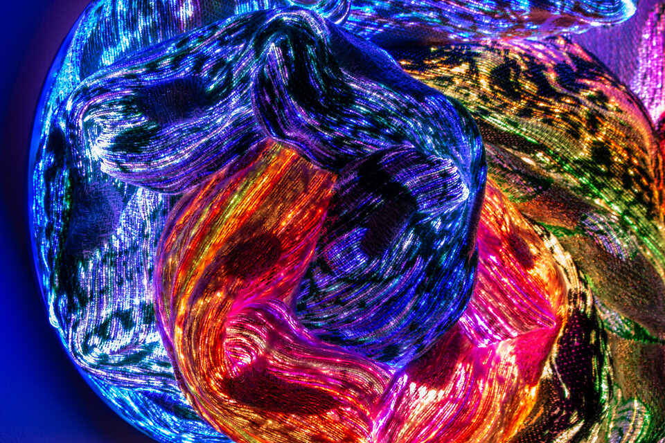 Detail shot of Emerald's dense weave in emerald green and amber.