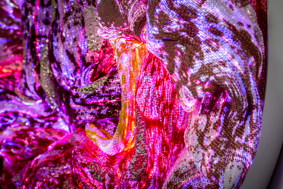 Macro shot of Ruby's structure, warm red threads in layers.